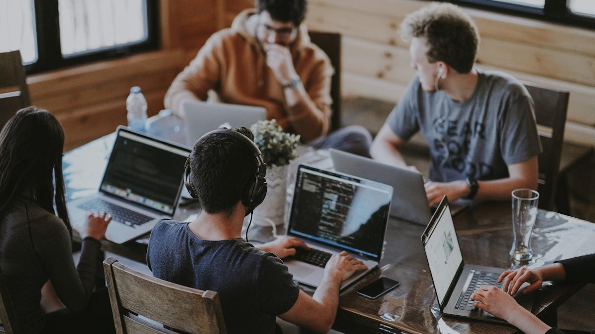 A team working together on laptops